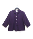 boxy aubergine button down top with a twin button detail along the front, back and sleeve cuffs