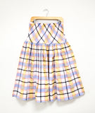 multicolor plaid skirt with a wide elastic waistband and a dropped waist with gathering