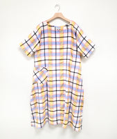 multicolor plaid dress with a single hip pocket, short sleeves and a rounded neckline