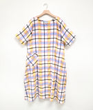 multicolor plaid dress with a single hip pocket, short sleeves and a rounded neckline