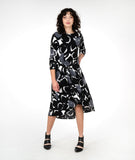 model in a black and white circle print dress with a twist detail at the hip