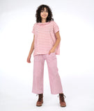 model in a red and white wide stripe top and a matching pant in pinstripe