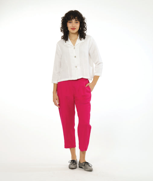 model in a cropped slim leg hot pink pant, worn with a white button down jacket with an open collar and long sleeves