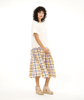 boxy white pullover top with a multi color plaid skirt