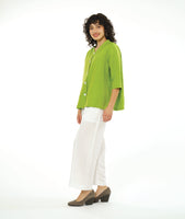 model in a wide leg white pant with a boxy lime button down blouse with a 3/4 sleeve and a small meandering collar