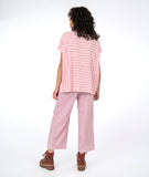 model in a red and white wide stripe top and a matching pant in pinstripe.