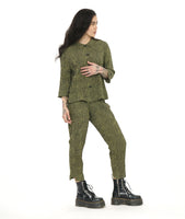 model in a slim green and black striped pant with a contrasting tuxedo stripe on the side and a stair step hem. worn with a matching boxy button down blouse with 3/4 sleeves with a split cuff and button detail