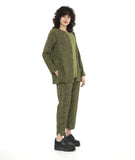 model in a black and green slim pant with a contrasting tuxedo stripe and stair strep hem. worn with a matching pullover top with long sleeves, a contrasting panel at the front center, and a round neckline with a split v cutout