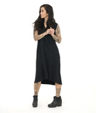 model in a black sleeveless dress with a v neck and center seam. hem is just below the knee, a-line silhouette with pockets at the hip side seams