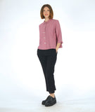 model in a slim black pant with a pink 3/4 sleeve button down blouse