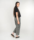 model in a black tshirt with a black and white striped pant with large rectangle pockets