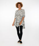 model in a multicolor rose print top with a mid-thigh length, round neckline and elbow length sleeves