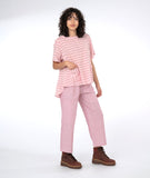 model in a red and white striped top with a matching pant in a pinstripe