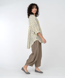 model in a wide leg brown pant and a yellow, white and grey stripe button down blouse