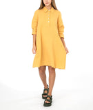 model in a yellow shirt dress