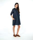model in a dark wash chambray shirt dress