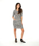 model in a black and white stripe tunic with a hip pocket set into a diagonal seam across the body