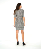 model in a black and white stripe tunic with a hip pocket set into a diagonal seam across the body