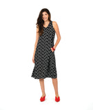 model in a long black tank dress with white polkadots