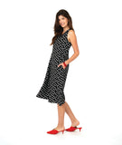 model in a long black tank dress with white polkadots