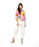 model in a white cropped pant with a lmulti color button up blouse