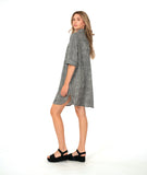 model in a black and white striped shirt dress