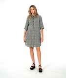 model in a black and white striped shirt dress
