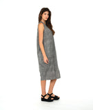model in a black and white striped sleeveless dress with contrasting stripe directions and oversized pockets