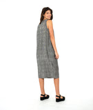 model in a black and white striped sleeveless dress with contrasting stripe directions and oversized pockets
