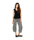 model in a black tank top with a black and white stripe wide leg pant with a tapered ankle