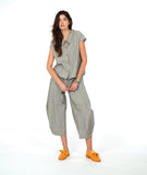 model in a wide barrel leg pant in a soft grey and white stripe with a yellow textured dot print. worn with a matching cap sleeve blouse with yellow buttons