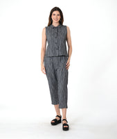model in a grey sleeveless top with a twin button detail, worn with a matching slim crop pant