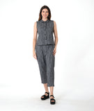 model in a grey sleeveless top with a twin button detail, worn with a matching slim crop pant