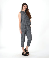 model in a grey sleeveless top with a twin button detail, worn with a matching slim crop pant