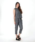 model in a grey sleeveless top with a twin button detail, worn with a matching slim crop pant