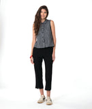 model in a grey sleeveless top with a twin button detail, worn with a slim black pant