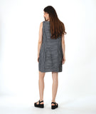 model in a grey sleeveless shift dress with a squared neckline and princess seams and gathered pockets at the hips
