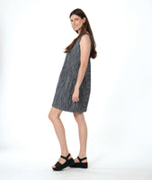 model in a grey sleeveless shift dress with a squared neckline and princess seams and gathered pockets at the hips