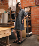 model in a grey pullover dress with an open flat collar and a short sleeve