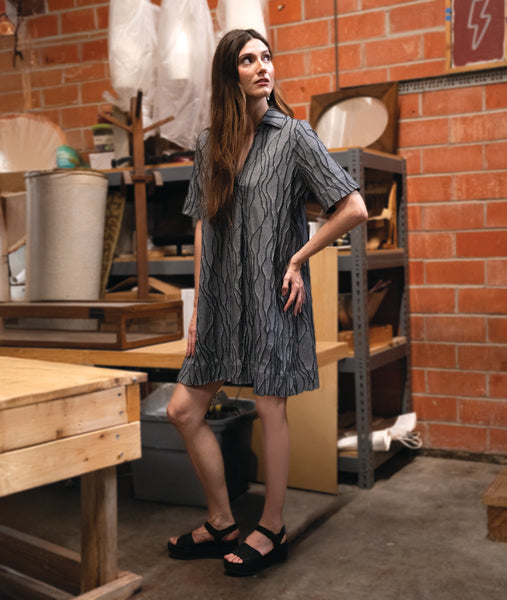 model in a grey pullover dress with an open flat collar and a short sleeve