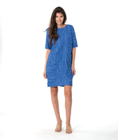 model in a blue shift dress with princess seams and pockets at the hips
