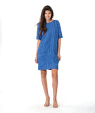 model in a blue shift dress with princess seams and pockets at the hips
