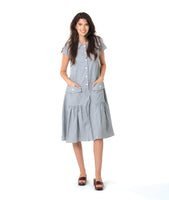 model in a grey and white pinstripe shirtdress with a gathered skirt detailng and hip pockets