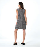 model in a sleeveless black and white plaid shift dress with princess seams, a squared neckline and hip pockets