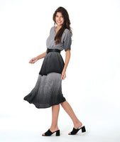 model in a black and white ombre gradient dress with a double layer skirt