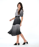model in a black and white ombre gradient dress with a double layer skirt