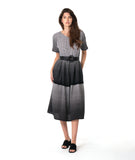 model in a black and white ombre gradient dress with a double layer skirt