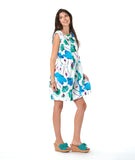 model in a white shift dress with a vibrant floral print. dress is sleeveless with a squared neckline, princess seams, and hip pockets