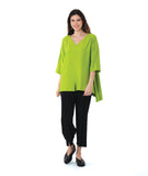 model in a slim black pant, worn with a lime color pullover blouse with a low back hem and a vneck