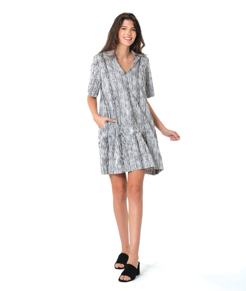 model in a black and white striped dress with short sleeves, knee length and an open, flat collar